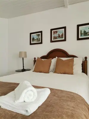 a bedroom with two beds with towels on them at Casa Cadu - Porto in Porto