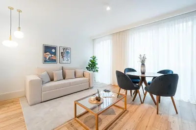 a living room with a couch and a table at GuestReady - Central stay in Porto in Porto