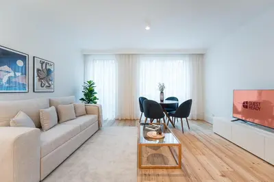 a living room with a couch and a table at GuestReady - Central stay in Porto in Porto