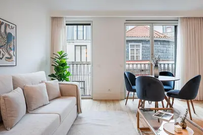 a living room with a couch and a table at GuestReady - Central stay in Porto in Porto