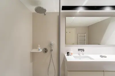 a bathroom with a sink and a mirror at GuestReady - Central stay in Porto in Porto