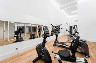 a gym with several exercise bikes in a room at GuestReady - Central stay in Porto in Porto