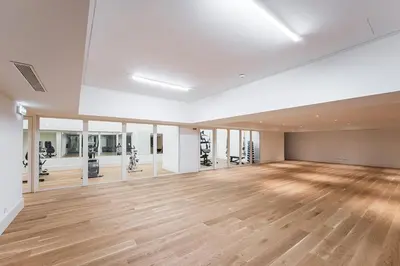 an empty room with a gym with a wooden floor at GuestReady - A peaceful home near downtown in Porto