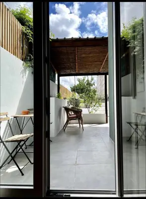 an open door to a patio with a table at Porto Vintage House in Porto