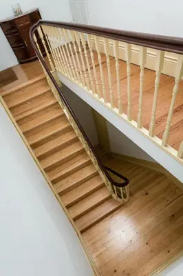 a wooden staircase with a metal rail and wooden floor at Apartment Bolhao Market by Sweet Porto in Porto