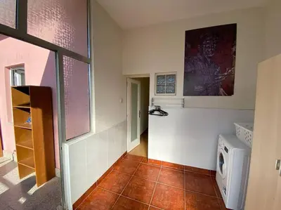 a room with a window with a view of a city at Casa do Carmo in Porto