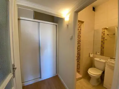 a laundry room with a washer and dryer in it at Casa do Carmo in Porto
