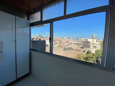 a view of a city from a room with windows at Casa do Carmo in Porto