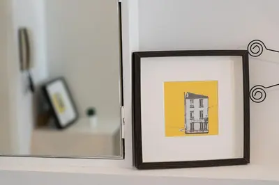 a picture of a building in front of a mirror at GuestReady - Peaceful home with a private backyard in Porto