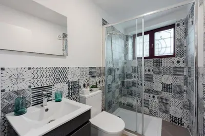 a bathroom with a sink and a toilet and a shower at Bonfim Apartment by Best2Stay in Porto