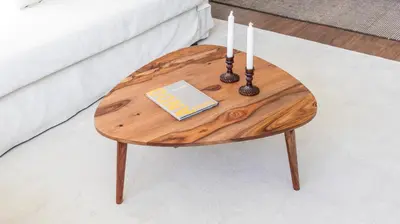 a wooden table with two candles and a book at 2BR Wonder in the City Center by LovelyStay in Porto