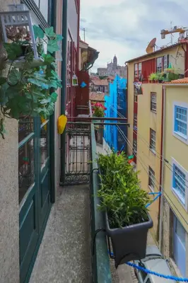 a view of an alley with plants on a balcony at Porto Insight Apartments- with balcony in Porto