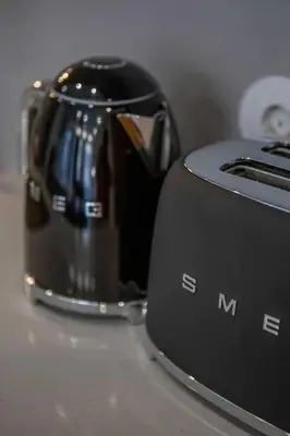 a toaster sitting on top of a counter at Ribeira Apartments Baixa in Porto