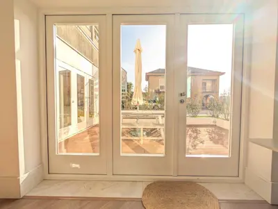 a sliding glass door with a view of a patio at dvnest - Premium 1BR Apartment Designed for Remote Work in Porto