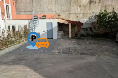 a parking lot with a car in front of a building at dvnest - Premium 1BR Apartment Designed for Remote Work in Porto