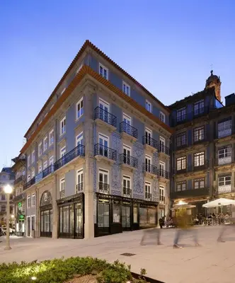 a large building with people walking in front of it at Porto A.S. 1829 Hotel in Porto