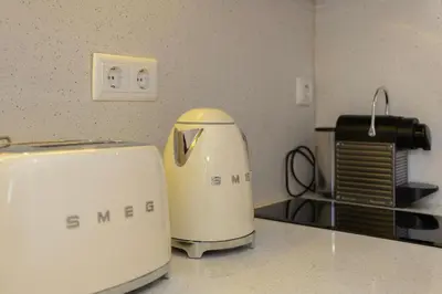 a toaster sitting on a counter in a kitchen at Liiiving in Porto - Trindade Deluxe Studios in Porto