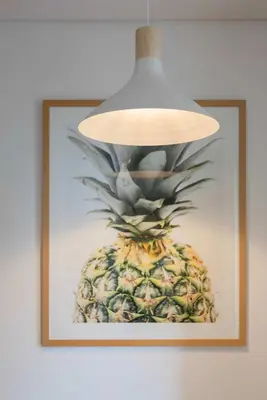 a picture of a pineapple hanging on a wall at Liiiving in Porto - Trindade Deluxe Studios in Porto