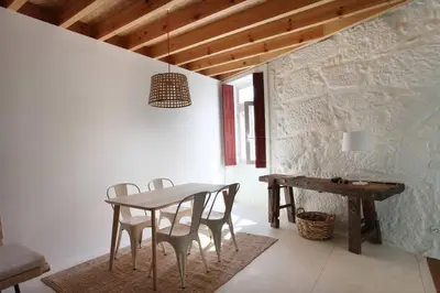 a dining room with a table and chairs at Wood & Blue House - Porto in Porto