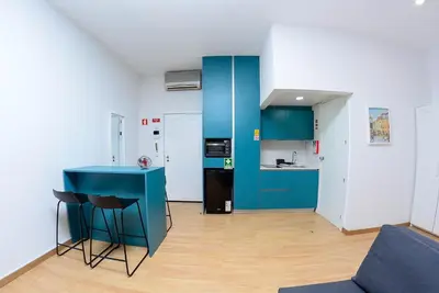 a kitchen with blue cabinets and a blue counter top at Bonsai Apartment 6 in Porto