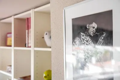 a picture of a black and white photo of a man at GuestReady - A charming duplex home near Boavista in Porto