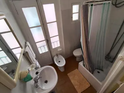 a bathroom with a sink and a toilet and a shower at Porto Chique AL 4 in Porto