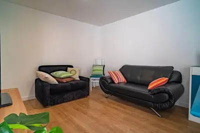 a living room with two chairs and a couch at Casa da fonte in Vila Nova de Gaia