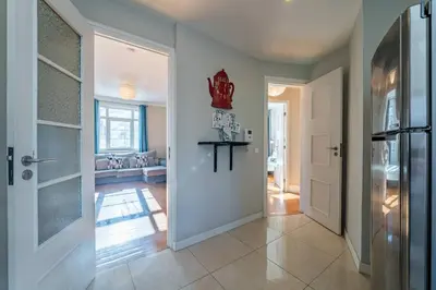 a hallway with a door leading to a living room at Large and Charming Apartment Downtown in Porto