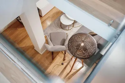 an overhead view of a room with a chair and a table at 24 Agosto Amazing Triplex by Vacationy in Porto