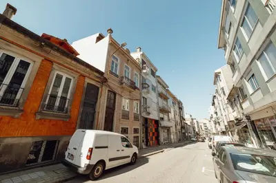 a white van parked on the side of a street at 24 Agosto Amazing Triplex by Vacationy in Porto