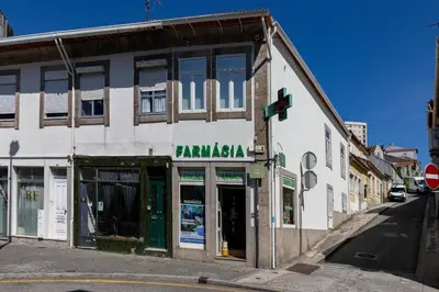 an old building on the corner of a street at D&S - Antas House in Porto
