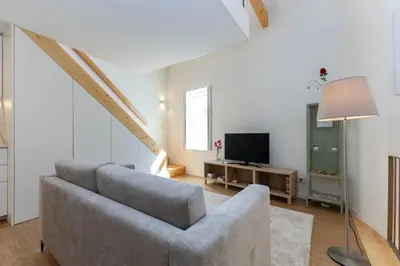 a living room with a couch and a television at D&S - Antas House in Porto