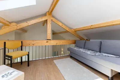 a living room with a couch and a chair at D&S - Antas House in Porto