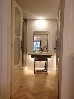a bathroom with a sink and a mirror at 90 Studio in Porto