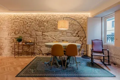 a dining room with a table and two chairs at 90 Studio in Porto