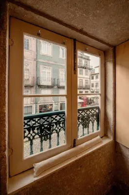 an open window with a view of a city at 90 Studio in Porto