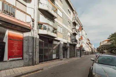 a street with a car parked next to a building at Downtown Aquarelle by Vacationy in Porto