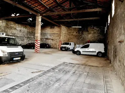 a parking lot with cars parked in a building at Groove-Wood Loft in Vila Nova de Gaia
