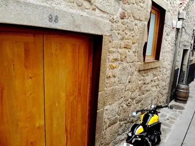 a motorcycle parked in front of a building at Groove-Wood Loft in Vila Nova de Gaia