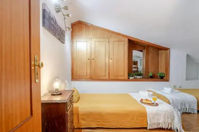a room with two beds and a mirror at Host Wise - Rustic Bright Flat - City Centre in Porto