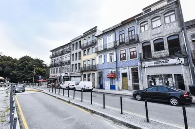 a city street with cars parked on the street at Poveiros Studio OPorto City Center in Porto