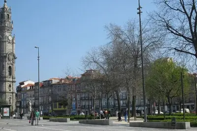 a city street with a clock tower and a building at Santa Catarina Oporto City Center in Porto