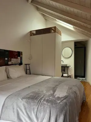 a bedroom with a large bed in a room at Get bindings and books on duplex in Porto