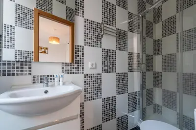 a bathroom with a sink and a shower at Host Wise - Stylish Adorable Flat in Gaia in Vila Nova de Gaia