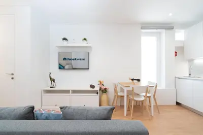a living room with a couch and a table at Host Wise - Sweet Sunny Flat with Balcony in Vila Nova de Gaia