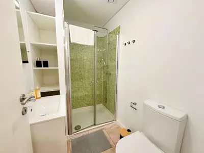a bathroom with a shower and a toilet at Downtown Premiu in center of Porto 3BR with AC in Porto