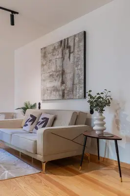 a living room with a couch and a table at Prime Clerigos by Hosty in Porto