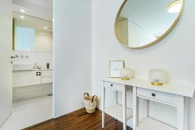a bathroom with a white vanity and a mirror at Bombarda 250 by LovelyStay in Porto