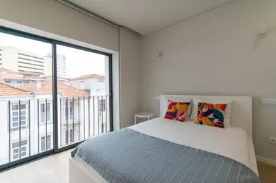 a living room with a couch and a table at Bolhão Market Apartment in Porto