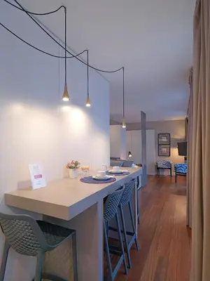 a kitchen with a island with bar stools at New Oporto Apartments - Cardosas in Porto